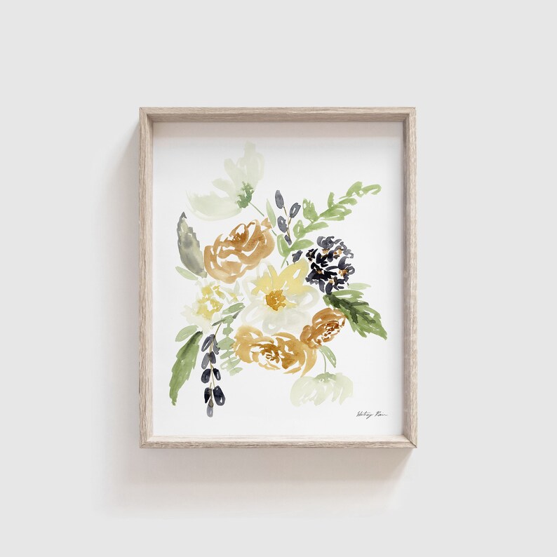 May include: Watercolor floral art print in a light wood frame. The artwork features a bouquet of flowers in shades of yellow, brown, and green. The print is on a white background, and the frame is a natural wood color.