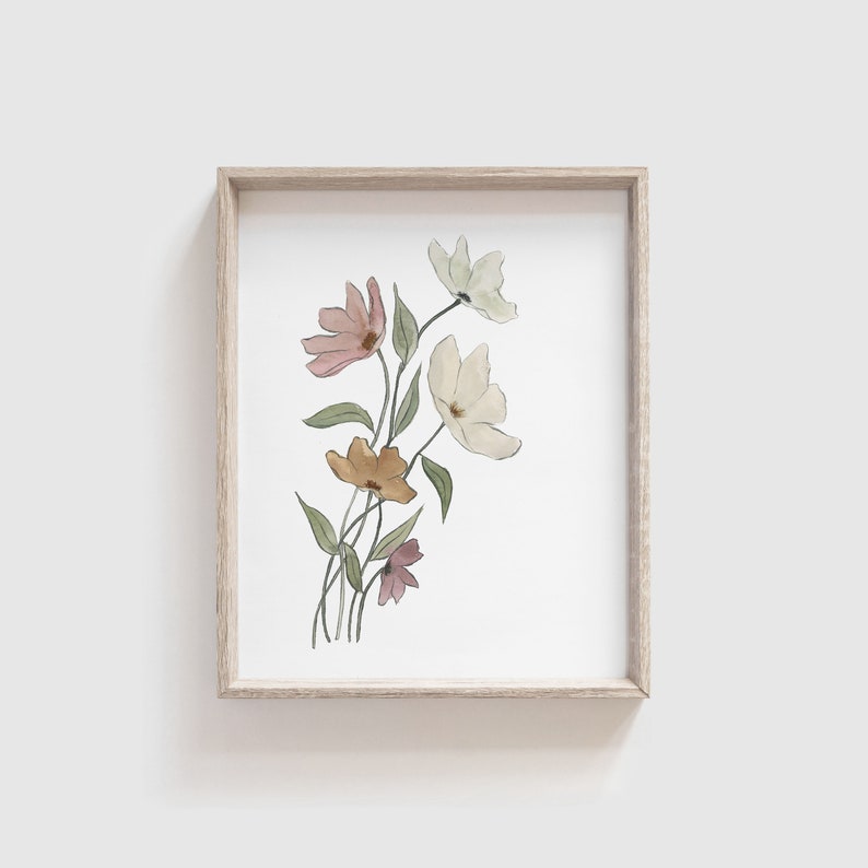 May include: A framed watercolor painting of a bouquet of flowers in shades of pink, yellow, and green. The flowers are delicate and have a soft, romantic feel.