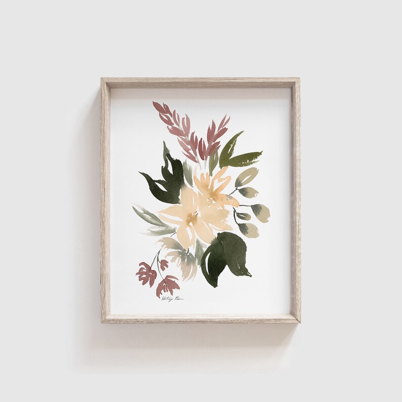 May include: A framed watercolor painting of a bouquet of flowers in shades of yellow, green, and pink. The flowers are arranged in a loose, organic style, and the painting has a soft, romantic feel.