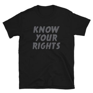 May include: Black t-shirt with the text "KNOW YOUR RIGHTS" in gray lettering.