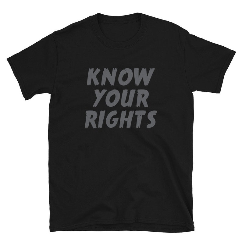 May include: Black t-shirt with the text "KNOW YOUR RIGHTS" in gray lettering.
