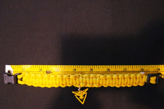 Pokeman Go Yellow Team Instinct Charm