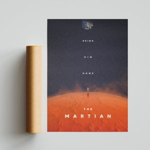 May include: A movie poster for the film "The Martian" featuring a lone astronaut standing on the surface of Mars. The poster has a dark blue background with stars and the text "Bring Him Home" in white. The astronaut is wearing a spacesuit and is looking up at the sky. The planet Earth is visible in the upper left corner of the poster.