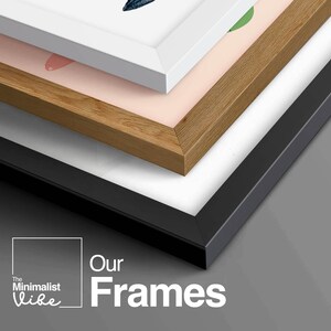 May include: Three picture frames stacked on top of each other. The top frame is white, the middle frame is wood, and the bottom frame is black. The text "Our Frames" is in white letters on a gray background.