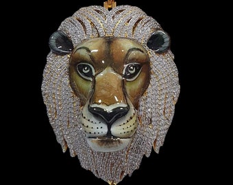May include: Gold lion head pendant with a diamond encrusted mane and the word "KING" on top.