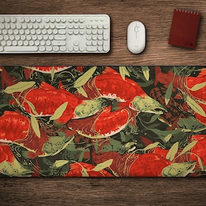 May include: A red and green mousepad with a pattern of salmon fish. The fish are swimming in a dark green background with green leaves.