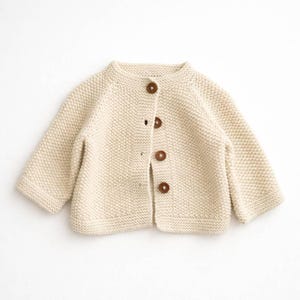 May include: A set of three ceramic mugs with a speckled, matte finish. The mugs are in shades of cream, light gray, and dark gray. Each mug has a simple, minimalist design, perfect for coffee or tea.