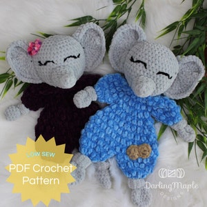 May include: Two handmade crochet elephant plushies. One elephant is wearing a dark purple outfit and a pink flower. The other elephant is wearing a blue outfit with a peanut patch. The text "LOW SEW PDF Crochet Pattern" is in the lower left corner.