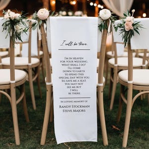 May include: White fabric banner with the text "I will be there" and a poem, hanging on a wooden chair at a wedding. The banner is decorated with floral arrangements. The text includes "In Loving Memory of Randy Stockman Steve Majors."