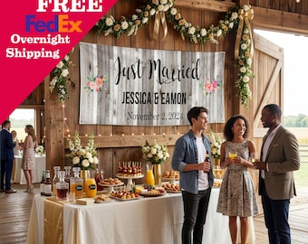 May include: A rectangular wedding banner featuring a rustic gray wood plank background with the text Just Married, the names Jessica & Eamon, and the date November 2, 2024, accented by floral illustrations on the left and right sides of the text.
