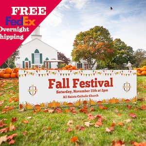 May include: A sign promoting a Fall Festival at All Saints Catholic Church, with text reading "Fall Festival, Saturday, November 11th at 2pm." The sign is decorated with pumpkins and colorful bunting, set against a backdrop of pumpkins and a white church.