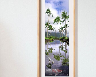 May include: A vertical framed wall art print featuring a pond with two koi fish swimming in clear water. The scene includes a reflection of tall palm trees and a cloudy sky on the water surface, with lush green foliage visible in the background.