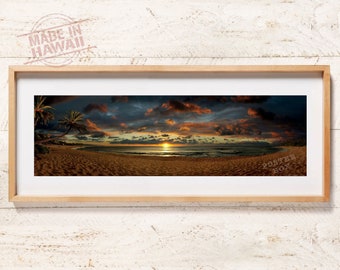May include: A panoramic photograph of a beach sunset with palm trees in the foreground. The sky is a mix of orange, pink, and purple with dark clouds. The sun is setting over the ocean, creating a golden glow on the water and sand.