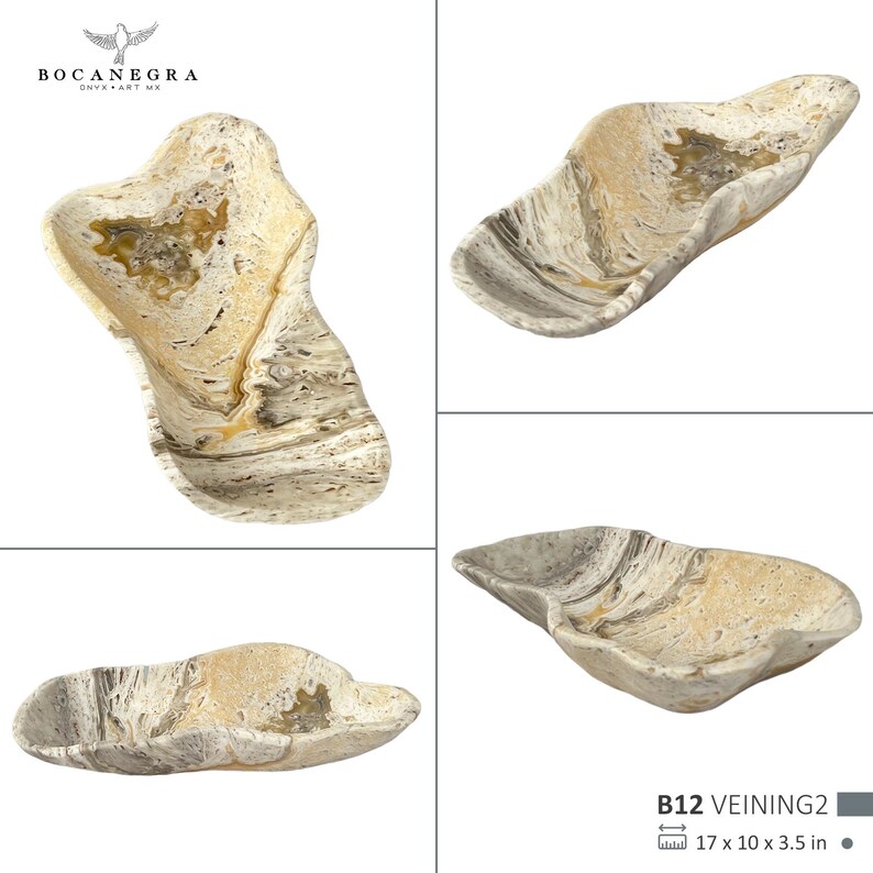 May include: A natural stone decorative bowl with a unique, organic shape. The bowl features a blend of beige, cream, and gray tones with a marbled effect. The dimensions are 17 x 10 x 3.5 inches.
