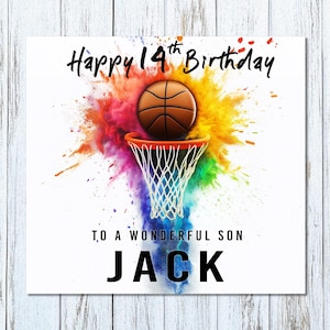 K&ouml;nnte beinhalten: Geburtstagskarte mit Basketball-Motiv. Sie zeigt einen braunen Basketball &uuml;ber einem orangefarbenen Korb und Netz, vor einem farbenfrohen Farbspritzer. Der Text lautet: "Happy 14th Birthday To A Wonderful Son JACK."