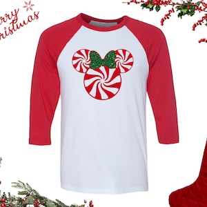 Disney Christmas Shirt | Mickey Mouse and Minnie Mouse Candy Cane w/Green Glitter Bow | 3/4 Sleeve Unisex BELLA+CANVAS Raglan Baseball Tee