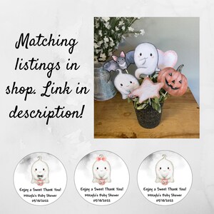 May include: Three round stickers with a cute ghost illustration. Each sticker has the text "Enjoy a Sweet Thank You! Mikayla's Baby Shower 09/18/2022" and the word "Boo" in pink.