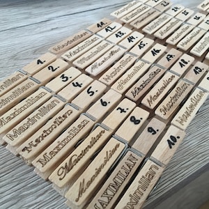 Wooden clothespins with desired text