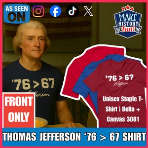 May include: A navy blue t-shirt with the text "'76 > 67 Jefferson" and a red sign that says "FRONT ONLY". The image also shows three t-shirts in red, blue, and maroon, with the text "'76 > 67 Jefferson" and "Unisex Staple T-Shirt | Bella + Canvas 3001".