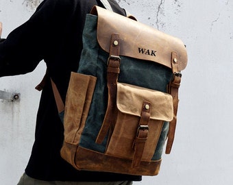 May include: A brown leather and canvas backpack with a large front pocket and adjustable straps. The backpack has the word "WAK" printed on the front.