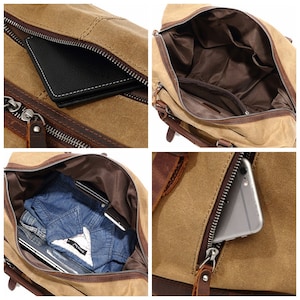 May include: A tan canvas duffel bag with brown leather accents and a zippered closure. The bag has multiple compartments, including an interior pocket and a zippered exterior pocket. A black wallet and a smartphone are visible inside.