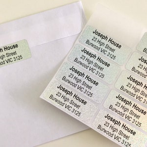 May include: A sheet of iridescent silver address labels with the text "Joseph House, 23 High Street, Burwood VIC 3125" repeated multiple times.
