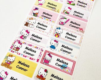 May include: A sheet of colorful Hello Kitty themed personalized name labels with the names Melissa and Connor printed on each label. The labels feature various Hello Kitty images and designs.