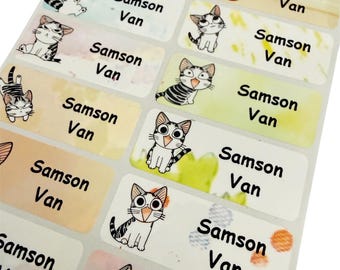 May include: A sheet of rectangular stickers featuring cartoon cats in various poses. Each sticker has the name "Samson Van" printed in black. The background colors vary, including yellow, green, and blue, with some stickers showing watercolor-like effects.