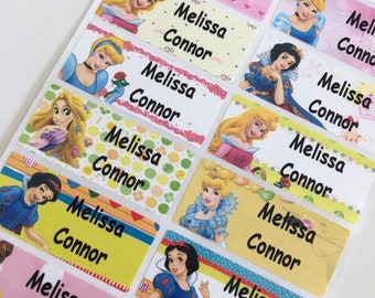 May include: A sheet of colorful princess-themed name labels with the names Melissa and Connor printed on each label. The labels feature various Disney princesses, including Cinderella, Snow White, and Belle.