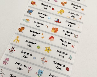 May include: A sheet of colorful, illustrated name labels with the name "Samson Van" repeated on each label. The labels feature various animal and object illustrations, including a fox, a giraffe, a snowman, a star, an owl, a cat, and a fish.