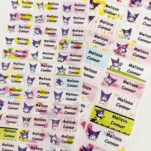May include: Sheet of personalized name labels featuring the name "Melissa Connor" in various colors and designs. Each label includes a cartoon character. The labels are rectangular and have a glossy finish.