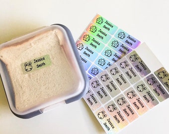 May include: A set of iridescent holographic name labels with a star and bunny design. The labels feature the name "Jessica Smith" and are perfect for labeling lunchboxes, school supplies, or other personal items.