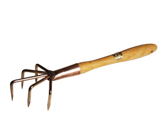 May include: A copper hand rake with a wooden handle. The rake has five tines and is used for gardening.