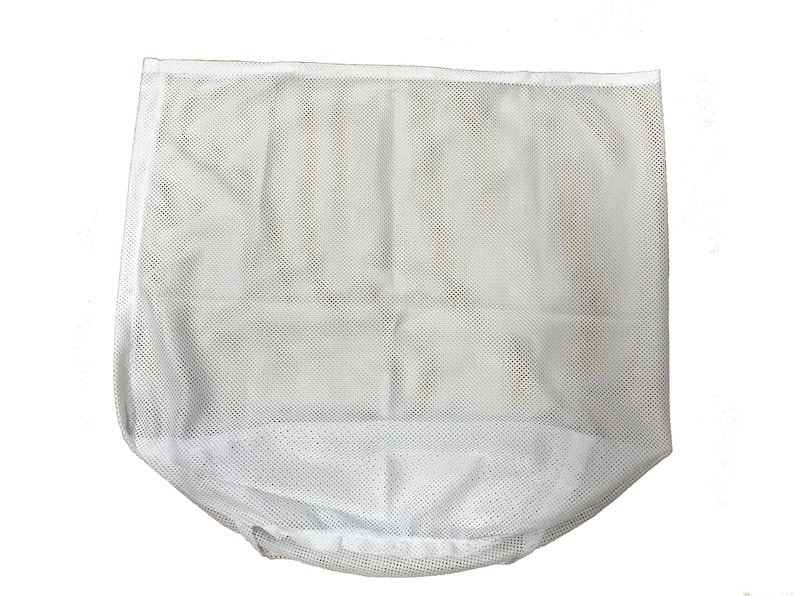 May include: A white mesh laundry bag, rectangular in shape with a rounded bottom. The bag is made of a fine, open weave material, allowing for air circulation. The bag is designed to hold and protect delicate items during washing.