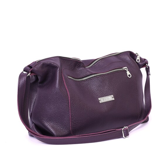 purple leather messenger bag
