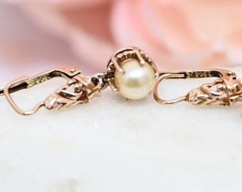 Pendientes victorianos de perla de 12 quilates con cierre de palanca en oro rosa antiguo.