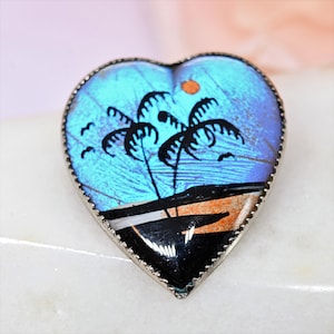 Art Deco blue Morpho butterfly wing brooch reverse painted palm trees vintage jewelry
