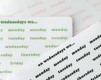 May include: A sheet of stickers with the days of the week written on them. The stickers are in different colors and fonts. The text on the stickers reads "on wednesdays we..." and "wednesdays we..."