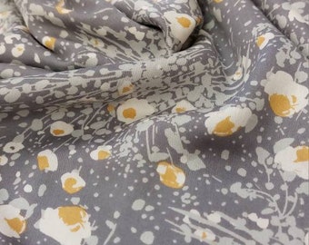 Viscose satin 140 cm wide floral print in light gray, ocher yellow falling slightly on a dark gray background