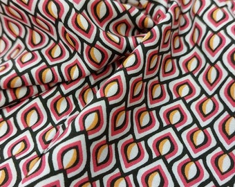 Viscose print geometric pattern 145 wide in white, red, black, yellow