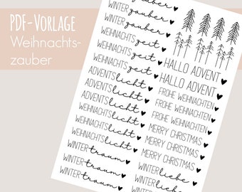 May include: A white sheet with black text and illustrations. The text includes phrases like "Winter Zauber," "Weihnachtszeit," and "Merry Christmas." The sheet also features small heart symbols and tree illustrations, perfect for holiday crafts.