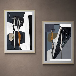 May include: Two abstract art prints in black, white, grey, and orange frames. The prints feature geometric shapes and lines with abstract figures.