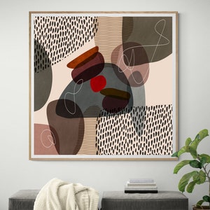 May include: Abstract art print in a wooden frame with a beige background and various shapes in shades of brown, red, and grey. The shapes are layered and overlapping, creating a dynamic composition.
