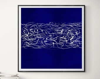 May include: Abstract art print featuring a deep blue background with a horizontal band of white, calligraphic-style lines. The artwork is framed in a black frame and hangs above a white sofa with white pillows, two wooden side tables, and a black and white striped rug.