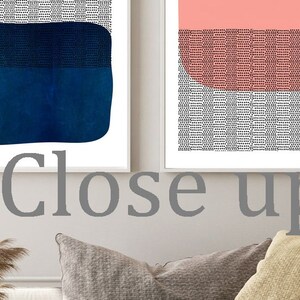 May include: Three framed abstract art prints. One features a yellow and black design, another a blue shape, and the third a pink and gray design. The text "Close up" is visible in the image.