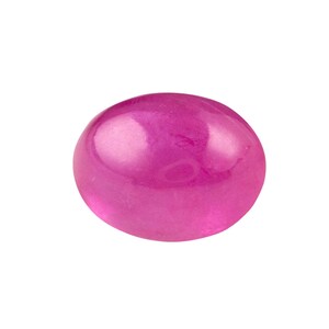 May include: A vibrant pink oval-shaped gemstone with a smooth, polished surface.