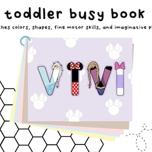 May include: A toddler busy book with a light purple cover featuring white mouse head silhouettes. The front page displays the name VIVI in large letters, each decorated with distinct character-themed patterns and colors, bound by a blue ring.