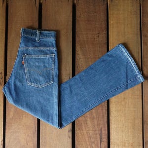 Jeansy Levi Strauss 646 z lat 80., ciemnoniebieskie, z wysokim stanem i zapięciem na guziki, W28, vintage, Levis 646-0217, pomarańczowe, z zakładkami, z wysokim stanem, wyprodukowane w USA