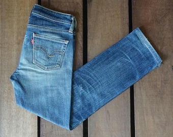 Vintage Levi's 502 Jeans: Faded Blue Tapered Leg, Made in Japan