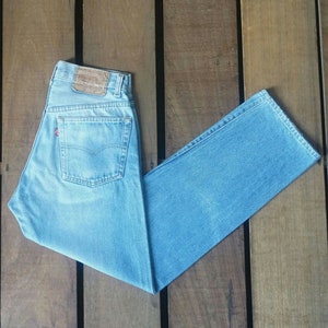 Vintage 80s Levi&#39;s 501 Jeans: Faded Blue Denim, High Waist Mom Fit (W27)
